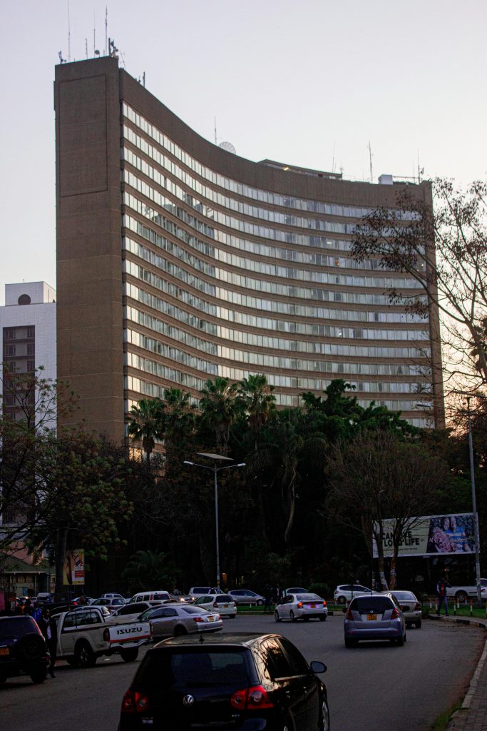 View of Monomotapa Hotel in Harare, Zimbabwe during the evening with surrounding traffic.